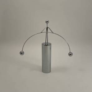 A Metal Perpetual Motion Funambulist Figurine